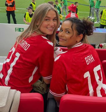 Alexander Bah girlfriend Nathalie Victoria Mengesha with Emilie Nissen, wife of Morten Hjulmand, at the stadium